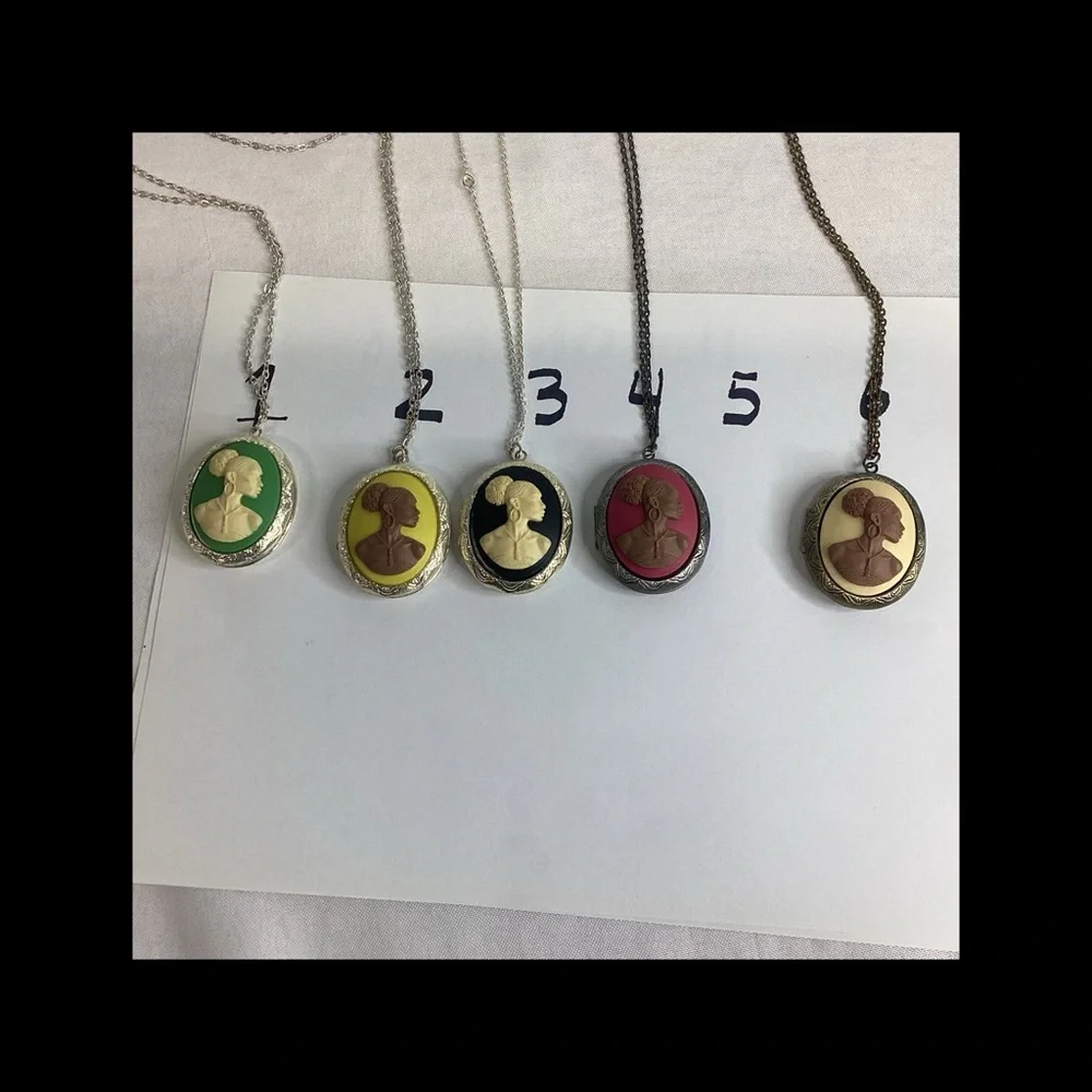 Multicolor raised cameo locket.